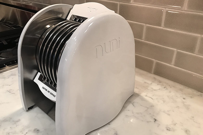 The Nuni Tortilla Toaster on a marble countertop