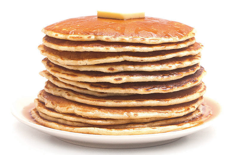 A plate of pancakes with butter on top