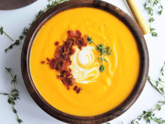 A bowl of Brown Butter Bacon Butternut Squash Soup shot from above