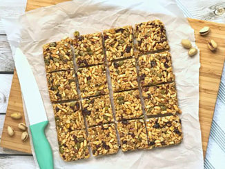 Cranberry Pistachio Granola Bar Squares shot from above and cut into 16 equal pieces.