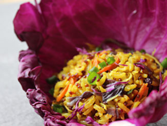 Curry-Spiced Grain dish served in a red cabbage leaf cup