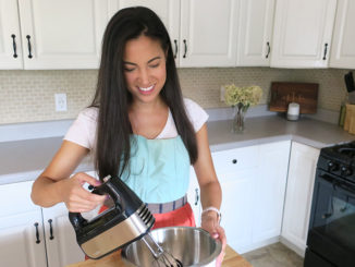 Dietitian Brittany Chin Jones using a Krups 10-speed mixer in her kitchen to make raspberry macarons