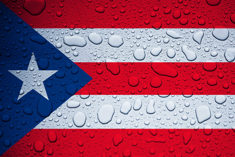 Illustrative editorial of Puerto Rico flag and rain drops