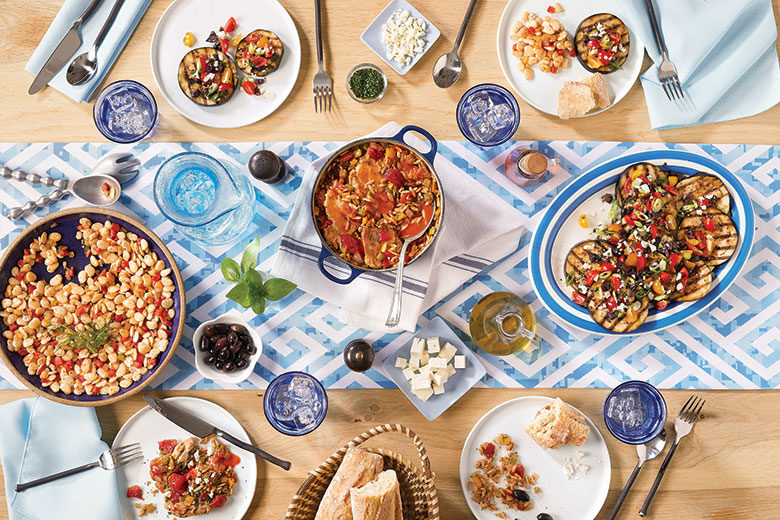Greek dishes on display on a table