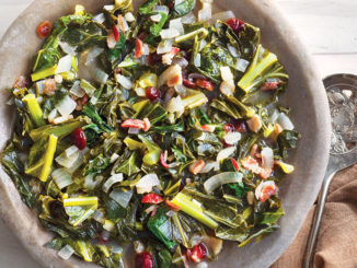 Vertical view of a bowl of warm collard and black-eyed pea salad