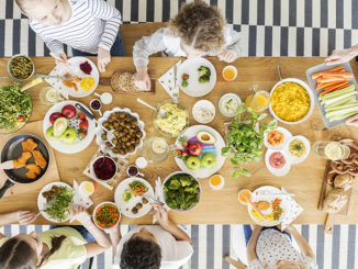 children eating healthy food during friend's birthday party