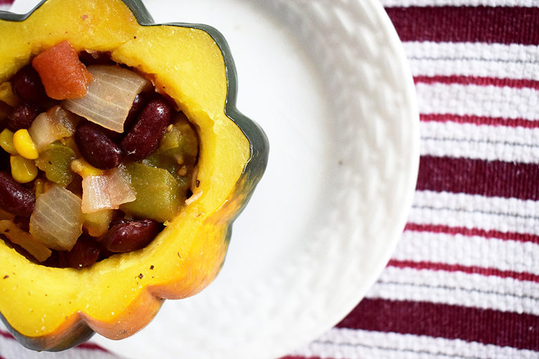 Acorn squash stuffed with vegan mix of vegetables and beans